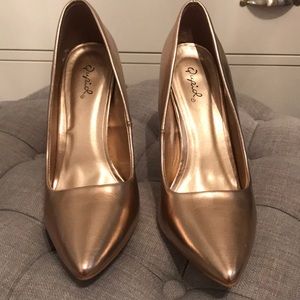 Rose gold pumps